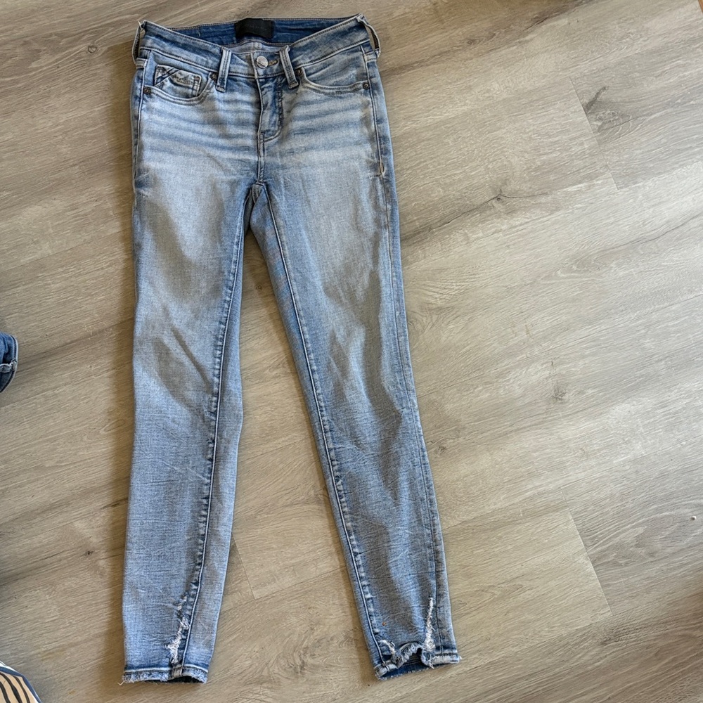 Buckle Light Wash Skinny Jeans